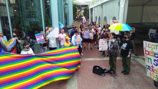 Dozens protest We Unify's Reclaiming Canada conference and its speaker lineup of notorious transphobes at the Victoria Conference Centre.
